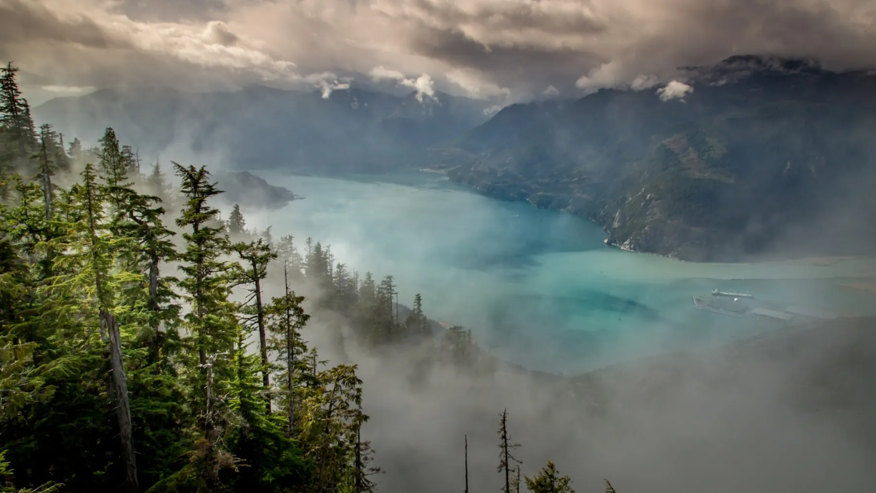 Morning mist over Howe Sound and the forested mountains above Squamish