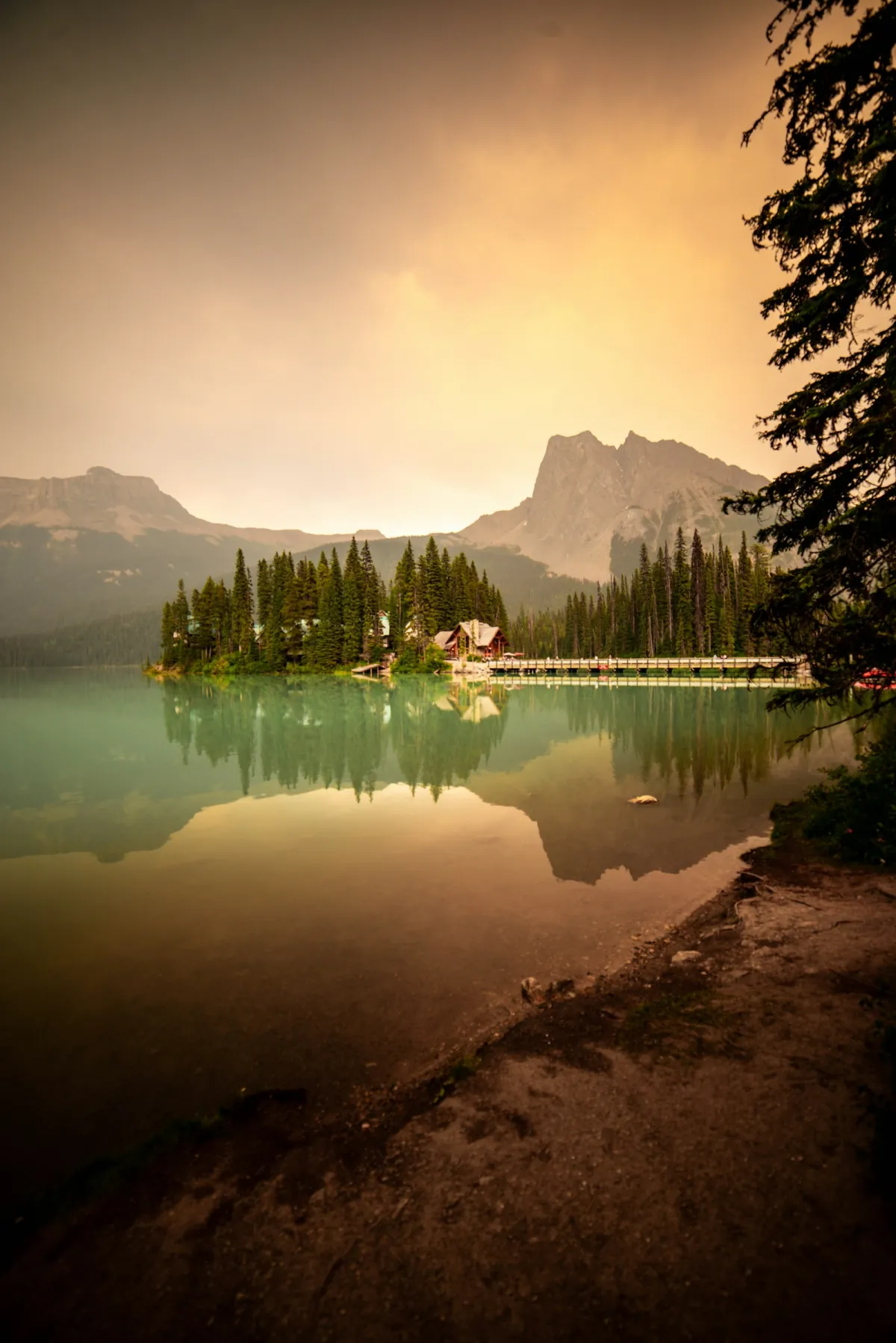 A lodge beside an emerald mountain lake